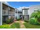 Exterior of building showcasing landscaping and walkway at 3937 Atrium Dr # 5, Orlando, FL 32822