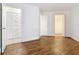 Bedroom with wood-look flooring and access to closets at 3937 Atrium Dr # 5, Orlando, FL 32822