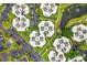 Aerial view of condo community with lush landscaping and pond at 3937 Atrium Dr # 5, Orlando, FL 32822