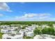 Aerial perspective of a residential community featuring numerous buildings, landscaping, and parking spaces at 3937 Atrium Dr # 5, Orlando, FL 32822