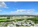 Aerial view of a residential community with various buildings, green spaces, and parking at 3937 Atrium Dr # 5, Orlando, FL 32822