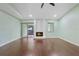 Bright living room with a fireplace, laminate flooring and access to a screened balcony at 8 Escondido Cir # 78, Altamonte Springs, FL 32701