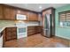 Updated kitchen, featuring wood cabinets, stainless steel appliances and granite countertops at 8 Escondido Cir # 78, Altamonte Springs, FL 32701