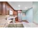 Modern kitchen with wood cabinets, granite counters and stainless steel appliances at 8 Escondido Cir # 78, Altamonte Springs, FL 32701