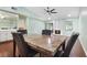 Dining area with fireplace, hardwood floors and kitchen view at 8 Escondido Cir # 78, Altamonte Springs, FL 32701