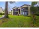 Condo building with a grassy area and landscaping at 8 Escondido Cir # 78, Altamonte Springs, FL 32701