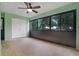Bright sunroom with tiled floors and ceiling fan at 8 Escondido Cir # 78, Altamonte Springs, FL 32701