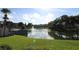 Serene lake view with fountain and lush greenery at 8 Escondido Cir # 78, Altamonte Springs, FL 32701