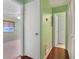 Clean hallway with light green walls and wood floors at 8 Escondido Cir # 78, Altamonte Springs, FL 32701