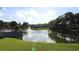 Tranquil lakefront community view with lush landscaping and water fountain at 8 Escondido Cir # 78, Altamonte Springs, FL 32701