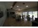 Community room with tables, chairs, and access to kitchen at 8 Escondido Cir # 78, Altamonte Springs, FL 32701