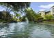 Relaxing community pool with fountain and lush landscaping at 8 Escondido Cir # 78, Altamonte Springs, FL 32701