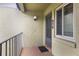 Private entrance with a door, window, and small balcony at 8 Escondido Cir # 78, Altamonte Springs, FL 32701