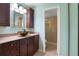 Updated bathroom with a modern vanity and a walk-in shower at 8 Escondido Cir # 78, Altamonte Springs, FL 32701