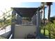 Covered patio furniture and grill near the pool at 8 Escondido Cir # 78, Altamonte Springs, FL 32701