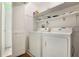 Laundry room with washer, dryer, and shelving at 8 Escondido Cir # 78, Altamonte Springs, FL 32701