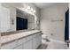 Bathroom with granite countertops and a single sink at 30215 Bretton Loop, Mount Dora, FL 32757