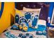 Bedroom with Minions-themed bedding and pillows at 4546 Narrative Ln, Kissimmee, FL 34746