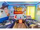 Toy Story themed bedroom with twin beds and mural at 4546 Narrative Ln, Kissimmee, FL 34746