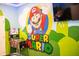 Super Mario themed game room with pinball machine at 4546 Narrative Ln, Kissimmee, FL 34746