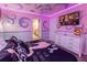 Disney Princess themed bedroom with a queen bed and mural at 4546 Narrative Ln, Kissimmee, FL 34746