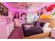 Disney Princess themed bedroom with a queen bed and mural at 4546 Narrative Ln, Kissimmee, FL 34746