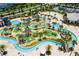 Aerial view of a community water park with lazy river, slides, and mini golf at 4546 Narrative Ln, Kissimmee, FL 34746
