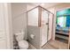 Bathroom with a toilet and a large glass shower at 4546 Narrative Ln, Kissimmee, FL 34746