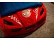 Red racecar bed with Spiderman logo and checkered flags at 4546 Narrative Ln, Kissimmee, FL 34746