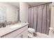 Simple bathroom with a shower/tub combo and grey accents at 4546 Narrative Ln, Kissimmee, FL 34746