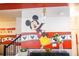 Entryway with Mickey Mouse wall art and stairs at 4546 Narrative Ln, Kissimmee, FL 34746