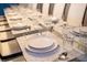Formal dining setting with place settings for a large dinner party at 4546 Narrative Ln, Kissimmee, FL 34746