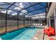Screened pool and spa with lounge chairs at 4546 Narrative Ln, Kissimmee, FL 34746
