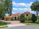 Beautiful home with tile roof, paver driveway, and lush landscaping at 11954 Provincial Way, Windermere, FL 34786