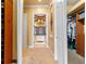 Bright hallway with carpet flooring and access to bathroom and closets at 11954 Provincial Way, Windermere, FL 34786