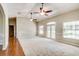 Bright living area with hardwood and carpeted floors, and multiple windows at 3202 Misty Morn Ct, St Cloud, FL 34771
