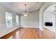 Formal dining room with hardwood floors, chandelier, and wainscoting at 3202 Misty Morn Ct, St Cloud, FL 34771