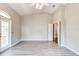 Spacious Gathering room featuring hardwood floors and access to backyard at 3202 Misty Morn Ct, St Cloud, FL 34771