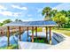 Covered boat dock with deck and canal access at 3202 Misty Morn Ct, St Cloud, FL 34771