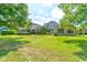 Beautiful two-story home with lush landscaping and a spacious lawn at 3202 Misty Morn Ct, St Cloud, FL 34771