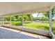 Screened porch with view of the backyard and trees at 3202 Misty Morn Ct, St Cloud, FL 34771