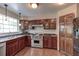 Spacious kitchen with stainless steel appliances and ample wood cabinetry at 3202 Misty Morn Ct, St Cloud, FL 34771