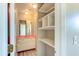 Bathroom with vanity, shelving and updated flooring at 3202 Misty Morn Ct, St Cloud, FL 34771
