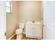 Simple and clean bathroom with white vanity and wood flooring at 3202 Misty Morn Ct, St Cloud, FL 34771