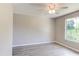 Spacious bedroom with large window and ceiling fan at 3202 Misty Morn Ct, St Cloud, FL 34771