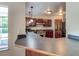 Modern kitchen with stainless steel appliances and dark wood cabinets at 3202 Misty Morn Ct, St Cloud, FL 34771