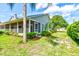 View of house exterior with lush landscaping at 3202 Misty Morn Ct, St Cloud, FL 34771