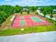 Aerial view of tennis and pickleball courts at 3202 Misty Morn Ct, St Cloud, FL 34771