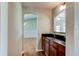 Convenient wet bar with dark countertop and wooden cabinetry at 3202 Misty Morn Ct, St Cloud, FL 34771