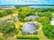 Two-story home on waterfront property with lush landscaping at 3202 Misty Morn Ct, St Cloud, FL 34771
